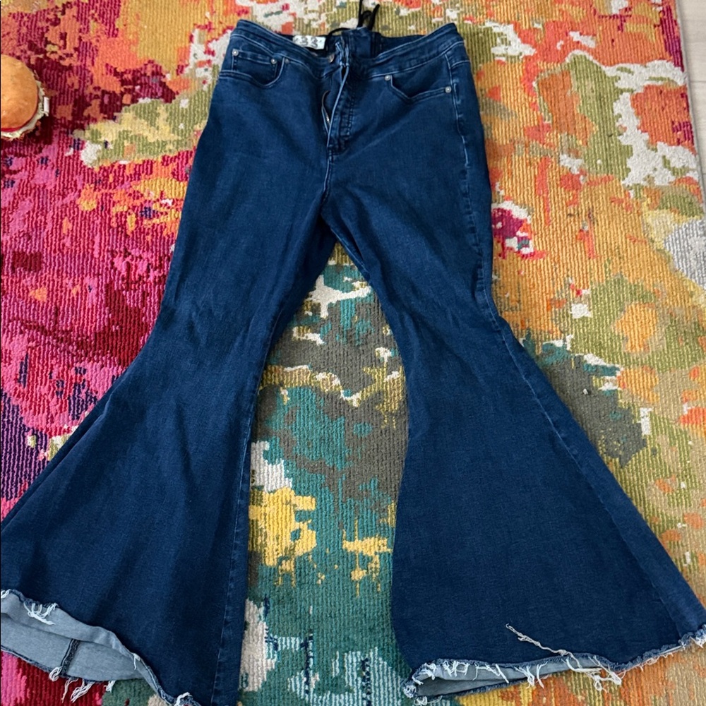 We The Free Dark Blue High-Rise Flare Jeans with Raw Hem